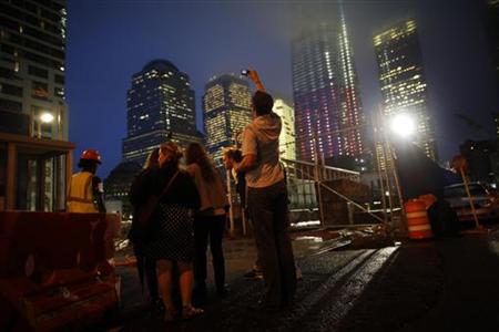 Visitors look at the World Trade Center site in New York Visitors look at the World Trade Center site in New York