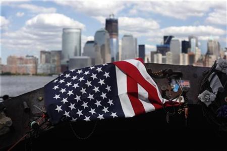 A U.S. flag is seen on a twisted piece of steel from the September 11th attacks on the World Trade Center, is seen at a memorial site across A U.S. flag is seen on a twisted piece of steel from the September 11th attacks on the World Trade Center, is seen at a memorial site across