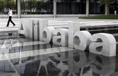A man walks past a logo of Alibaba (China) Technology Co. Ltd at its headquarters on the outskirts of Hangzhou A man walks past a logo of Alibaba (China) Technology Co. Ltd at its headquarters on the outskirts of Hangzhou