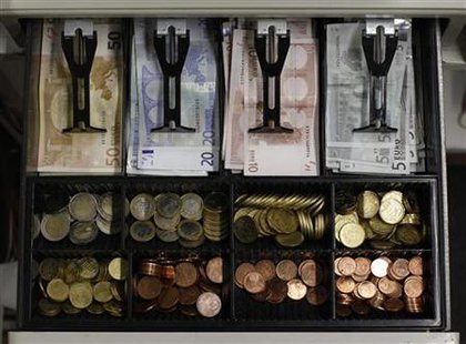 Euro banknotes and small coins are pictured in open cash register in Olching Euro banknotes and small coins are pictured in open cash register in Olching