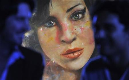 A painting 'Amy' by British artist Andersson is seen hanging at a pub in central London A painting 'Amy' by British artist Andersson is seen hanging at a pub in central London