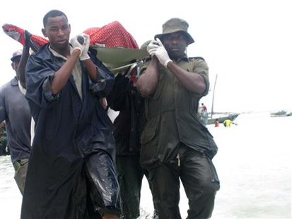 Rescuers carry the bodies of victims from a ferry tragedy near Zanzibar Island at Nungwi Beach Rescuers carry the bodies of victims from a ferry tragedy near Zanzibar Island at Nungwi Beach