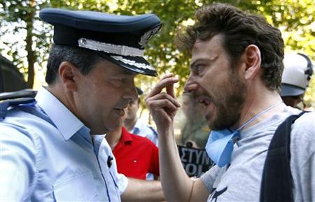Police officer argues with protester in Thessaloniki Police officer argues with protester in Thessaloniki