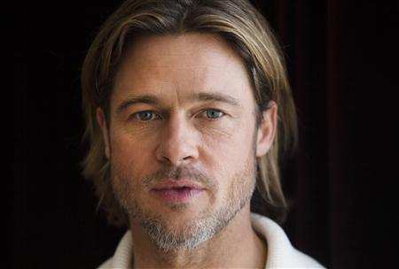 Actor Pitt of the film "Moneyball" poses during the 36th Toronto International Film Festival in Toronto Actor Pitt of the film "Moneyball" poses during the 36th Toronto International Film Festival in Toronto