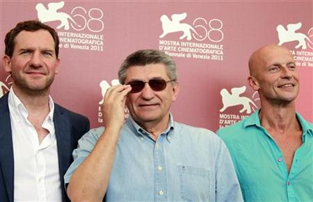 Director Alexander Sokurov poses with actors Johannes Zeiler and Anton Adasinskiy during a photocall for Faust at the 68th Venice Film Festi Director Alexander Sokurov poses with actors Johannes Zeiler and Anton Adasinskiy during a photocall for Faust at the 68th Venice Film Festi