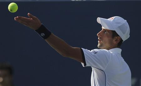 Novak Djokovic of Serbia serves to Roger Federer of Switzerland during their semi-final match at the U.S. Open tennis tournament in New York Novak Djokovic of Serbia serves to Roger Federer of Switzerland during their semi-final match at the U.S. Open tennis tournament in New York