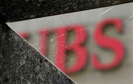 A cobweb is seen in front of the logo of Swiss bank UBS in Zurich A cobweb is seen in front of the logo of Swiss bank UBS in Zurich