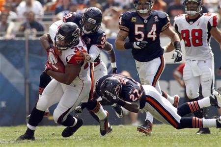 Falcons' Turner runs for a first down during their game against the Bears in Chicago Falcons' Turner runs for a first down during their game against the Bears in Chicago