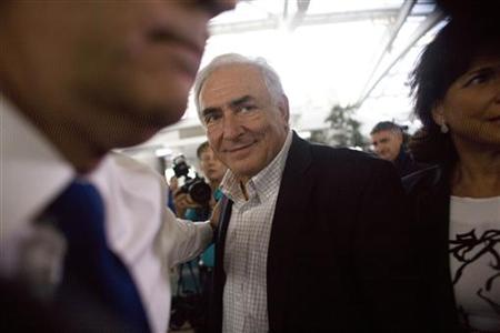 Former IMF chief Dominique Strauss-Kahn enters JFK airport in New York Former IMF chief Dominique Strauss-Kahn enters JFK airport in New York
