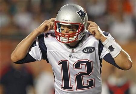 Patriots quarterback Brady gestures as he calls a signal during the first quarter of their NFL football game against the Dolphins in Miami Patriots quarterback Brady gestures as he calls a signal during the first quarter of their NFL football game against the Dolphins in Miami