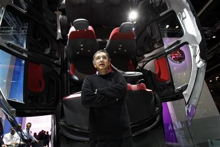 Fiat CEO Sergio Marchionne poses in front of a new Fiat Panda during the International Motor Show (IAA) in Frankfurt Fiat CEO Sergio Marchionne poses in front of a new Fiat Panda during the International Motor Show (IAA) in Frankfurt