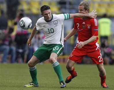 Keane of Ireland challenges Anyukov of Russia during their Euro 2012 Group B qualifying soccer match at Luzhniki Stadium in Moscow Keane of Ireland challenges Anyukov of Russia during their Euro 2012 Group B qualifying soccer match at Luzhniki Stadium in Moscow