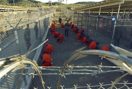 File photo of detainees sitting in a holding area at Naval Base Guantanamo Bay File photo of detainees sitting in a holding area at Naval Base Guantanamo Bay