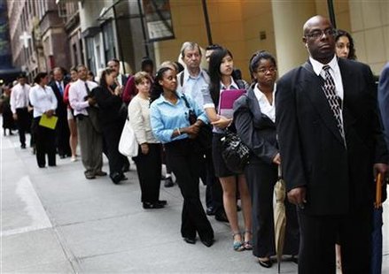 People wait in line to enter a job fair in New York People wait in line to enter a job fair in New York