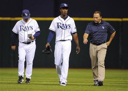 Tampa Bay Rays' Maddon, Upton and Porterfield walk during their MLB baseball game against Detroit Tigers in St. Petersburg Tampa Bay Rays' Maddon, Upton and Porterfield walk during their MLB baseball game against Detroit Tigers in St. Petersburg