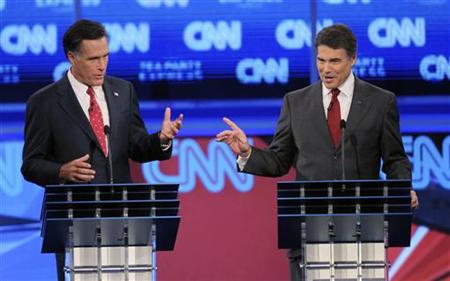 Texas Governor Perry and former Massachusetts Governor Romney exchange comments during the CNN/Tea Party Republican presidential candidates Texas Governor Perry and former Massachusetts Governor Romney exchange comments during the CNN/Tea Party Republican presidential candidates