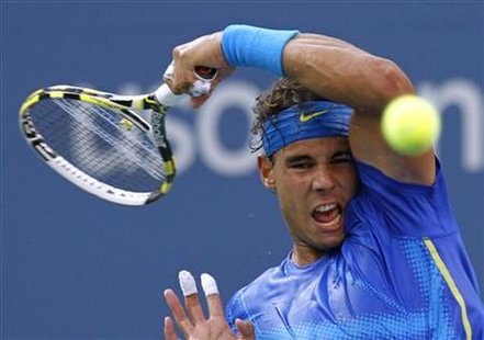 Rafael Nadal of Spain returns to Novak Djokovic of Serbia during the men's final of the U.S. Open tennis tournament in New York Rafael Nadal of Spain returns to Novak Djokovic of Serbia during the men's final of the U.S. Open tennis tournament in New York