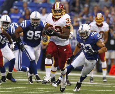 Washington's Hightower gets away from Indianapolis' Moala and Bullitt during a preseason NFL football game in Indianapolis Washington's Hightower gets away from Indianapolis' Moala and Bullitt during a preseason NFL football game in Indianapolis