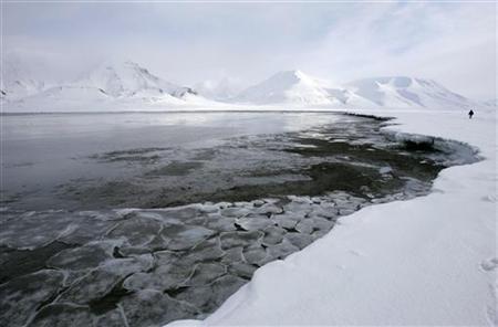 Ice breaks away from a frozen coastline near the Norwegian Arctic town of Longyearbyen Ice breaks away from a frozen coastline near the Norwegian Arctic town of Longyearbyen