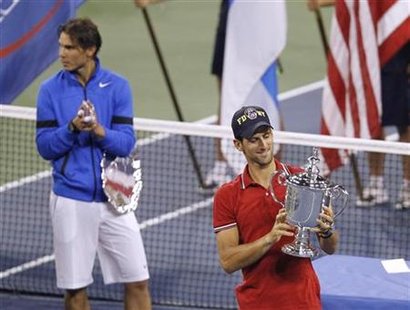 Novak Djokovic of Serbia and Rafael Nadal of Spain hold their trophies after Djokovic won the men's final of the U.S. Open tennis tournament Novak Djokovic of Serbia and Rafael Nadal of Spain hold their trophies after Djokovic won the men's final of the U.S. Open tennis tournament