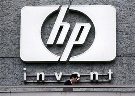 File photograph of a man walking past the Hewlett Packard logo at its French headquarters in Issy le Moulineaux File photograph of a man walking past the Hewlett Packard logo at its French headquarters in Issy le Moulineaux
