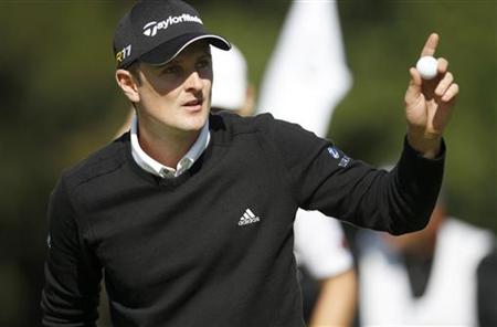 Britain's Justin Rose waves to the crowd after making birdie on the ninth hole during the first round of the PGA TOUR FedExCup BMW Champions Britain's Justin Rose waves to the crowd after making birdie on the ninth hole during the first round of the PGA TOUR FedExCup BMW Champions