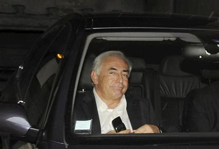 Former IMF chief Dominique Strauss-Kahn leaves his apartment, hours after being questioned by police, in Paris Former IMF chief Dominique Strauss-Kahn leaves his apartment, hours after being questioned by police, in Paris