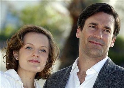Cast members Moss and Hamm pose during a photocall to promote their television series "Mad Men" at the annual MIPCOM television programme ma Cast members Moss and Hamm pose during a photocall to promote their television series "Mad Men" at the annual MIPCOM television programme ma