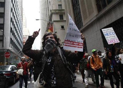 Protesters demonstrate near Wall Street against banks and corporations in New York Protesters demonstrate near Wall Street against banks and corporations in New York