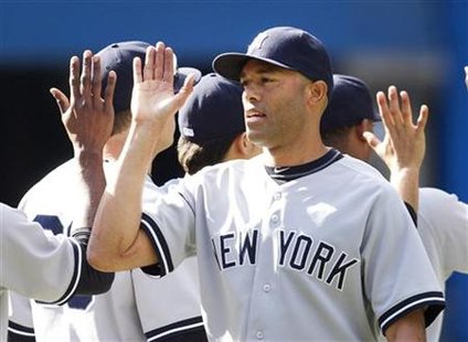 New York Yankees' Rivera is congratulated after tying the major league all time saves record during their MLB baseball game against Toronto New York Yankees' Rivera is congratulated after tying the major league all time saves record during their MLB baseball game against Toronto