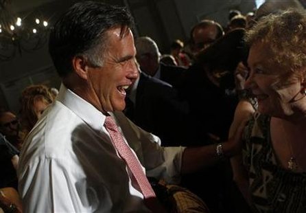 Republican presidential candidate and former Massachusetts Governor Mitt Romney greats a woman during a town hall meeting in Sun Lakes, Ariz Republican presidential candidate and former Massachusetts Governor Mitt Romney greats a woman during a town hall meeting in Sun Lakes, Ariz