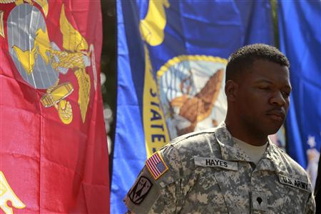 Army Specialist William Hayes, who is bisexual, listens to a news conference in Los Angeles Army Specialist William Hayes, who is bisexual, listens to a news conference in Los Angeles