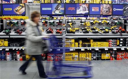 A customer passes a display of tools at a Lowe's store in Quincy A customer passes a display of tools at a Lowe's store in Quincy