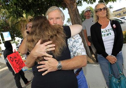 Ron Thomas, father of Kelly Thomas, receives hug from supporter outside District Attorney's office as he waits for information from news con Ron Thomas, father of Kelly Thomas, receives hug from supporter outside District Attorney's office as he waits for information from news con