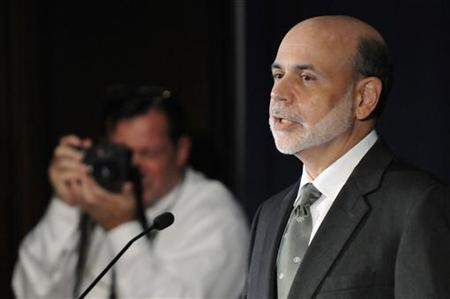 Bernanke is photographed as he makes remarks at the start of a conference on systemic risk, at the Federal Reserve in Washington Bernanke is photographed as he makes remarks at the start of a conference on systemic risk, at the Federal Reserve in Washington