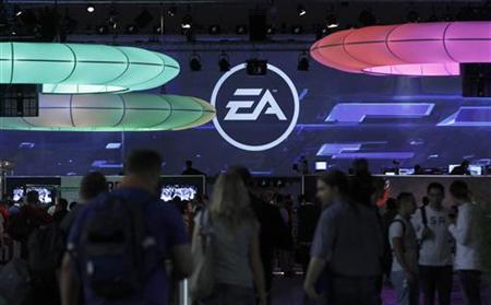Visitors walk past the exhibition stand of Electronic Arts at the Gamescom 2010 fair in Cologne Visitors walk past the exhibition stand of Electronic Arts at the Gamescom 2010 fair in Cologne