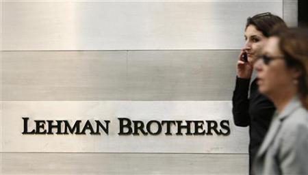 Pedestrians walk past a Lehman Brothers sign in New York Pedestrians walk past a Lehman Brothers sign in New York