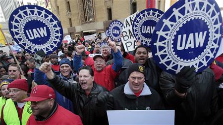 United Auto Workers convention delegates chant during a rally for good jobs and tax reform following a UAW convention in Detroit, Michigan, United Auto Workers convention delegates chant during a rally for good jobs and tax reform following a UAW convention in Detroit, Michigan,