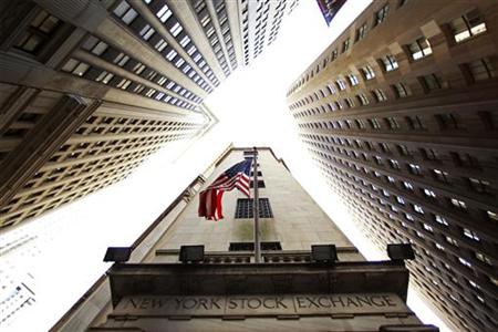 A flag flies outside the door of the New York Stock Exchange in New York A flag flies outside the door of the New York Stock Exchange in New York