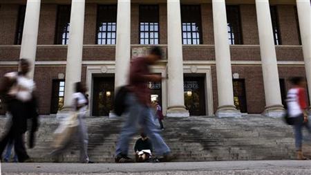 A students sits on the steps of Widener Library at Harvard University in Cambridge A students sits on the steps of Widener Library at Harvard University in Cambridge