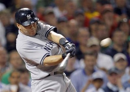 New York Yankees Russell Martin hits a two-RBI triple in their MLB game against the Boston Red Sox at Fenway Park in Boston New York Yankees Russell Martin hits a two-RBI triple in their MLB game against the Boston Red Sox at Fenway Park in Boston
