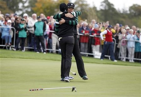 Norway's Pettersen of Team Europe celebrates with her teammate Gustafson of Sweden after she holes her putt at the 18th hole during her Four Norway's Pettersen of Team Europe celebrates with her teammate Gustafson of Sweden after she holes her putt at the 18th hole during her Four