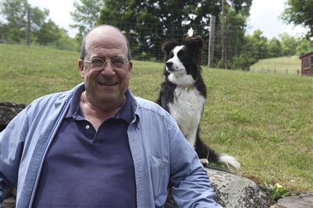 Publicity photo of author Jon Katz posing with a dog Publicity photo of author Jon Katz posing with a dog
