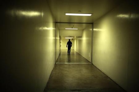 A sheriff's deputy walks down a hallway at the Orange County jail in Santa Ana A sheriff's deputy walks down a hallway at the Orange County jail in Santa Ana