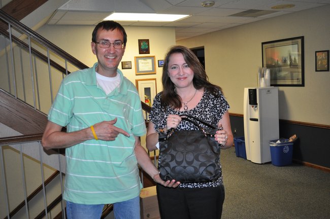 Here is Tony Waitekus with purse winner Carrie Heibler of Plover and her new Coach purse!