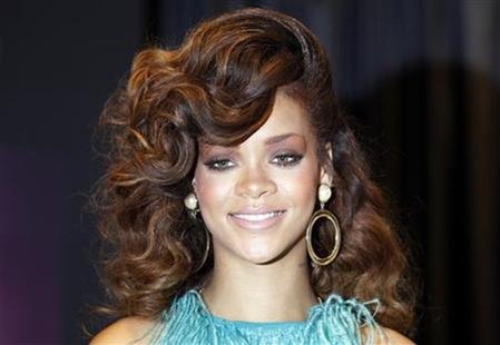 Singer Rihanna poses during the launch of her fragrance "Reb'l Fleur" at a House of Fraser department store on Oxford Street in London Singer Rihanna poses during the launch of her fragrance "Reb'l Fleur" at a House of Fraser department store on Oxford Street in London
