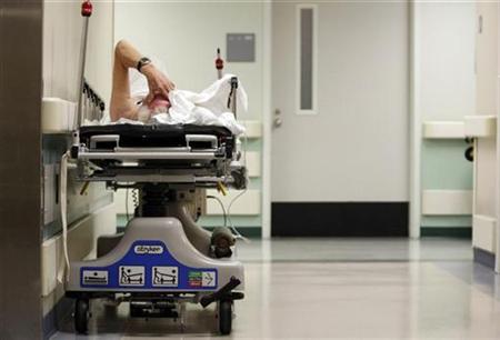 A patient waits in the hallway for a room to open up in the emergency room at Ben Taub General Hospital in Houston, Texas A patient waits in the hallway for a room to open up in the emergency room at Ben Taub General Hospital in Houston, Texas