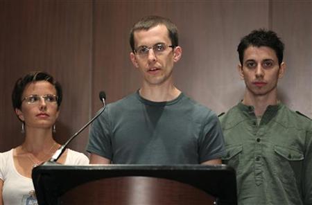 Sarah Shourd listens as Shane Bauer delivers a statement about his detention with Josh Fattal in Iran at a news conference in New York Sarah Shourd listens as Shane Bauer delivers a statement about his detention with Josh Fattal in Iran at a news conference in New York