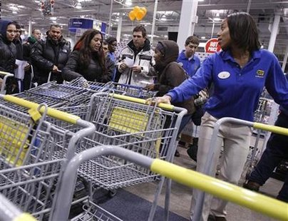 People reach for shopping carts during Black Friday sales at the Best Buy electronics store in Westbury,New York People reach for shopping carts during Black Friday sales at the Best Buy electronics store in Westbury,New York