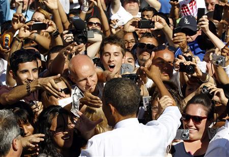 President Barack Obama greets supporters during an event at Abraham Lincoln High School in Denver President Barack Obama greets supporters during an event at Abraham Lincoln High School in Denver